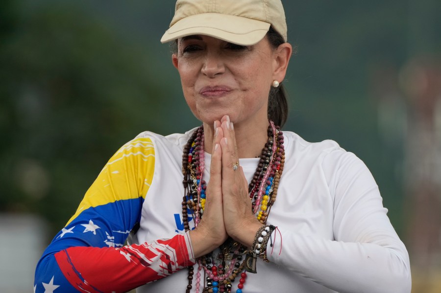 Opposition leader Maria Corina Machado greets supporters at a campaign rally for presidential candidate Edmundo Gonzalez, in Valencia, Venezuela, Saturday, July 13, 2024. (AP Photo/Ariana Cubillos)