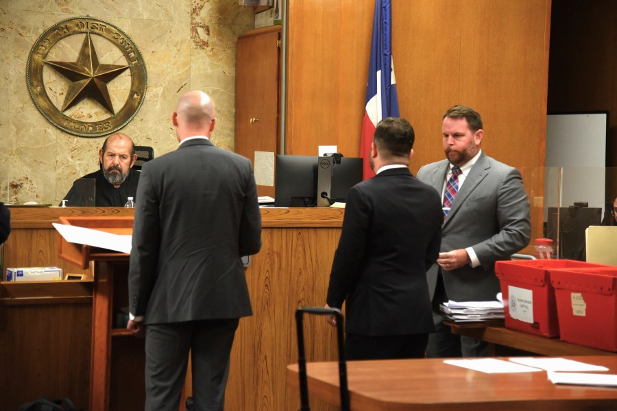 Texas state District Judge J.R. Flores hears arguments from Catholic Charities attorney William Powell, second left, as Matthew Kennedy and Levi Fuller with the Texas attorney general's office listen on Wednesday, July 17, 2024, in Edinburg, Texas. Catholic Charities is asking the court to prevent the state from deposing one of the organization's leaders. (AP Photo/Valerie Gonzalez)